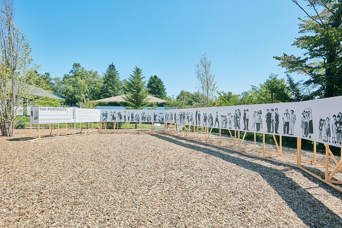 The portraits of more than 500 people of Miyota overwhelms the visitors.