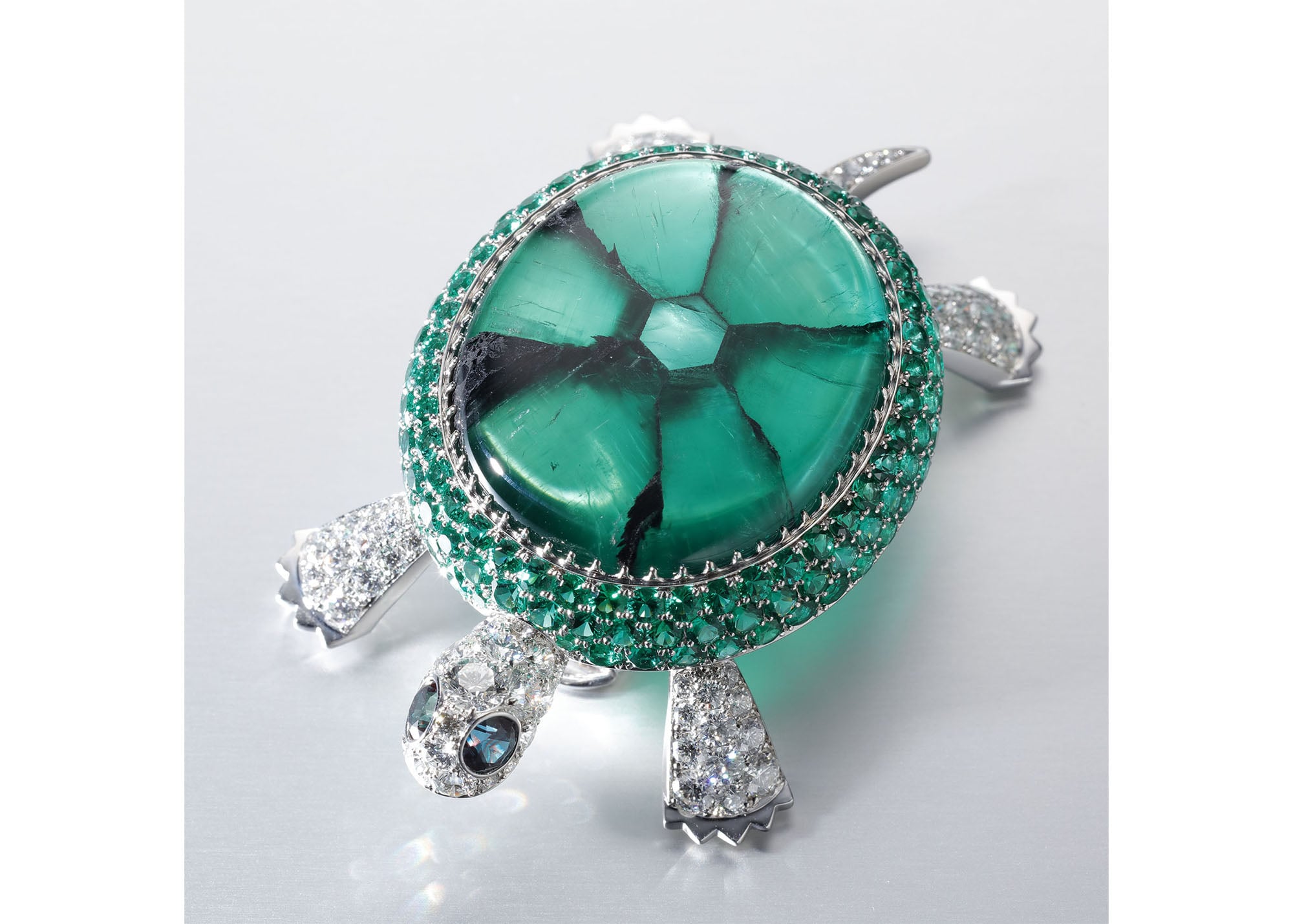  The “Turtle” brooch is designed using the unique crystal structure of the Trapiche Emerald. It is extremely rare to find a Trapiche Emerald with magnificent pattern, that clearly appears like this brooch. Brooch, Pt950, Trapiche Emerald, Emerald Diamond, Alexandrite (Not for Sale)